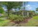 Well-maintained home with a screened porch and lush landscaping at 773 N Jefferson Ave # 773, Sarasota, FL 34237