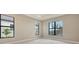 Bright bedroom with neutral tones, large windows, and modern trim at 10629 Nicklaus Ct, Englewood, FL 34223
