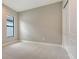 Empty bedroom with carpeted floor and a closet with double doors at 10629 Nicklaus Ct, Englewood, FL 34223