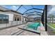 View of private pool, spa, and patio area with a protective safety fence at 10629 Nicklaus Ct, Englewood, FL 34223