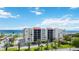 Beachfront condo building with ocean views and palm trees at 2045 Gulf Of Mexico Dr # M1-214, Longboat Key, FL 34228