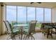 Outdoor dining set with views of the water on the screened balcony at 2825 Terra Ceia Bay Blvd # 1602, Palmetto, FL 34221