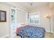 Cozy bedroom with a Murphy bed, custom shelving and a colorful bedspread at 2825 Terra Ceia Bay Blvd # 1602, Palmetto, FL 34221