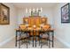 Classic dining room with wood table and chairs under modern pendant lighting at 2825 Terra Ceia Bay Blvd # 1602, Palmetto, FL 34221