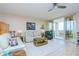 Bright living room with plush seating and sliding glass doors to the balcony at 2825 Terra Ceia Bay Blvd # 1602, Palmetto, FL 34221