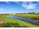 Peaceful view of a golf course with a pond at 5830 Wake Forest Run # 104, Bradenton, FL 34211