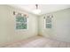 Spacious dining area with light walls and two windows at 930 Mill Creek Rd, Bradenton, FL 34212