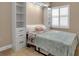 Bright bedroom with a murphy bed, built-in shelves and window shutters at 2825 Terra Ceia Bay Blvd # 1602, Palmetto, FL 34221