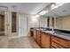 Elegant bathroom with double sinks, granite counters, and a large soaking tub at 2825 Terra Ceia Bay Blvd # 1602, Palmetto, FL 34221