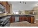 Modern kitchen with stainless steel appliances and dark wood cabinets at 2825 Terra Ceia Bay Blvd # 1602, Palmetto, FL 34221