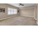 Spacious bedroom with a ceiling fan and large window with shutters at 2825 Terra Ceia Bay Blvd # 1602, Palmetto, FL 34221