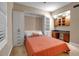 Bedroom with Murphy bed, built-in storage and window with shutters at 2825 Terra Ceia Bay Blvd # 1602, Palmetto, FL 34221