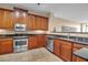 Modern kitchen with stainless steel appliances and dark wood cabinets at 2825 Terra Ceia Bay Blvd # 1602, Palmetto, FL 34221