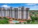 Condo building, pool, and surrounding landscape at 2825 Terra Ceia Bay Blvd # 1602, Palmetto, FL 34221