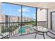 Screened balcony overlooks pool and partial ocean view at 6480 Midnight Pass Rd # 503, Sarasota, FL 34242