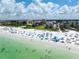 Aerial view showcasing beach, ocean, and building at 6480 Midnight Pass Rd # 503, Sarasota, FL 34242