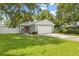 Newly built home with gray exterior, attached garage, and orange door at 109 Henry Ave, Plant City, FL 33563