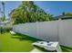 Spacious side yard with cornhole and lawn games at 2102 Avenue B, Bradenton Beach, FL 34217