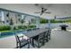 Outdoor dining area with pool and grilling station at 2102 Avenue B, Bradenton Beach, FL 34217