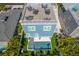 Stunning aerial view of the house and backyard amenities at 2102 Avenue B, Bradenton Beach, FL 34217