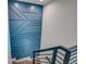 Modern staircase with geometric blue accent wall at 2102 Avenue B, Bradenton Beach, FL 34217