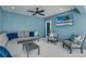 Relaxing patio with sectional sofa, armchairs, and TV at 2102 Avenue B, Bradenton Beach, FL 34217