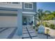 Welcoming front entrance with stone path and porch at 2102 Avenue B, Bradenton Beach, FL 34217