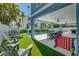 Inviting backyard with pool, patio furniture, and games at 2102 Avenue B, Bradenton Beach, FL 34217
