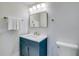 Bathroom with a navy blue vanity and a white countertop at 2102 Avenue B, Bradenton Beach, FL 34217