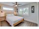 Bright bedroom with light wood floors and coastal decor at 2102 Avenue B, Bradenton Beach, FL 34217