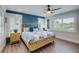 Main bedroom with a light wood frame bed and blue patterned bedding at 2102 Avenue B, Bradenton Beach, FL 34217