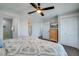 Bedroom with king-size bed, dresser, and mounted TV at 2102 Avenue B, Bradenton Beach, FL 34217