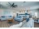 Open living space with light gray sofas, coffee tables, and hardwood floors at 2102 Avenue B, Bradenton Beach, FL 34217