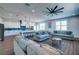 Modern kitchen with white cabinets, large island, and blue tile backsplash at 2102 Avenue B, Bradenton Beach, FL 34217