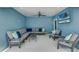 Relaxing patio with sectional sofa, armchairs, and TV at 2102 Avenue B, Bradenton Beach, FL 34217