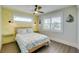 Bedroom with queen bed, yellow accent wall, and coastal decor at 2102 Avenue B, Bradenton Beach, FL 34217