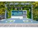 Bird's-eye view of home with pool and lush landscaping at 2102 Avenue B, Bradenton Beach, FL 34217