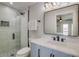 Bathroom with a walk-in shower, toilet and modern vanity at 2102 Avenue B, Bradenton Beach, FL 34217