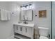 Modern bathroom featuring a vanity with a quartz countertop and a rectangular mirror at 2102 Avenue B, Bradenton Beach, FL 34217