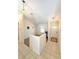Well-lit foyer features tiled flooring, a half wall and ample natural light from the front door at 623 147Th E St, Bradenton, FL 34212