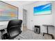 Home office with a large desk, chair, and TV at 750 Penfield St, Longboat Key, FL 34228