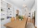 Bright dining room with built-in shelving and hardwood floors at 750 Penfield St, Longboat Key, FL 34228