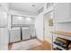 Laundry room with washer, dryer, and additional storage at 750 Penfield St, Longboat Key, FL 34228