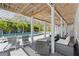 Covered patio area overlooking the pool at 750 Penfield St, Longboat Key, FL 34228