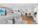 Open living room and kitchen with hardwood floors and comfy seating at 750 Penfield St, Longboat Key, FL 34228