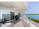 Spacious waterfront deck with grill and seating at 750 Penfield St, Longboat Key, FL 34228