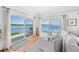 Bright living room with water views and access to a deck at 750 Penfield St, Longboat Key, FL 34228