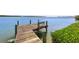Serene waterfront dock with bench at 750 Penfield St, Longboat Key, FL 34228