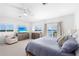 Main bedroom with water views, dresser, and comfortable seating at 750 Penfield St, Longboat Key, FL 34228