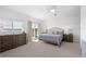 Bedroom with water views and dresser at 750 Penfield St, Longboat Key, FL 34228